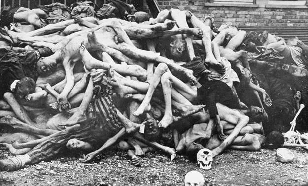 The bodies of former prisoners are piled outside the crematorium at the newly liberated Dachau concentration camp.